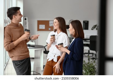 Business colleagues drinking coffee in office - Powered by Shutterstock