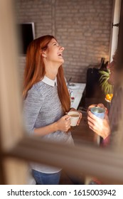 Business Colleagues Having Fun At The Office During A Coffee Break; Freelancers Woking Together In Coworking Space Taking A Coffee Break