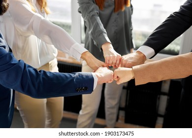 Business Colleagues Keep Fists Together, Hope For A Good Outcome And Successful Work Together