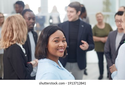 Business Colleagues Making Small Talk In Their Break