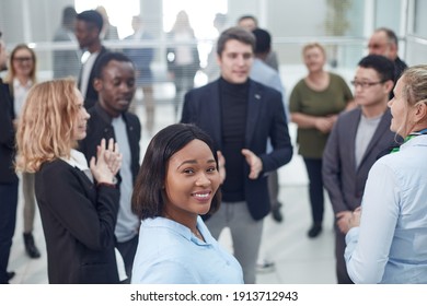 Business Colleagues Making Small Talk In Their Break