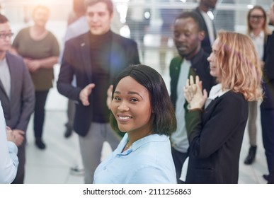 Business Colleagues Making Small Talk In Their Break