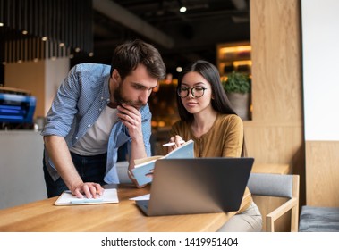 Business Colleagues Working Startup Project Together, Meeting, Brainstorming, Talking, Planning Strategy, Looking For Solution. Portrait Of Employer And Employee Sitting In Office. Successful Business