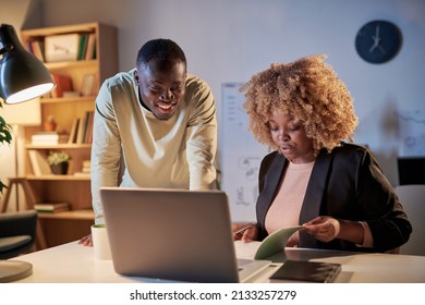 Business Colleagues Working Till Late At Office