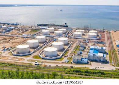 Business commercial trade fuel and energy transport by tanker vessel. Aerial view storage tank farm at night, Tank farm storage chemical petroleum petrochemical refinery product at oil terminal