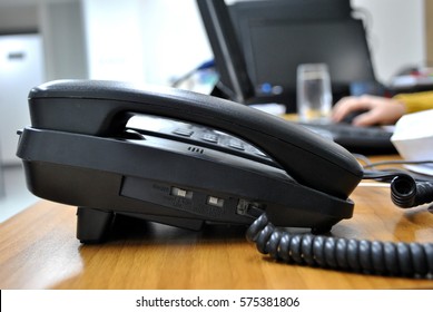 Business And Communication Concept - A Telephone On Office Desk.