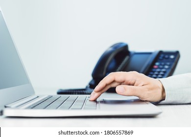 Business And Communications. Female Hand And Voip Phone In The Office. Finance Graphs. Laptop On Desk. IP Telephony, Cold Calling. Audit Accounting Small Business. Induction. Copy Space