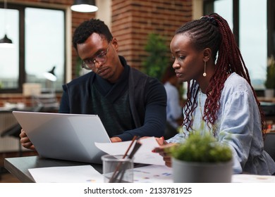 Business Company Finance Department Team Members Reviewing Financial Paperwork. Agency Office Workers Cooperating Regarding Startup Project Marketing Solutions While In Modern Office Interior.