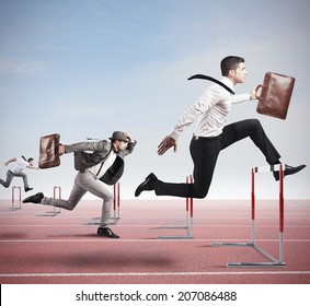 Business competition with jumping businessman over obstacle - Shutterstock ID 207086488
