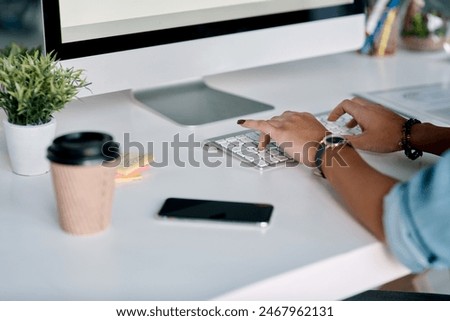 Business, computer and hands typing at office desk for online research, copywriting and editing newsletter. Creative person, copywriter or editor with desktop keyboard for website article or email