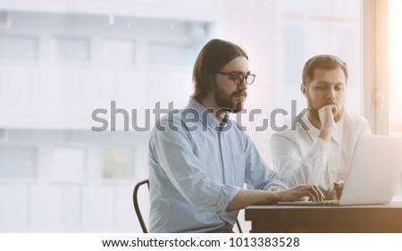 Business comunity. Two young working  businessmen 
