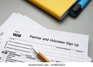 Business Concept About Form 14310 Partner And Volunteer Sign Up With Inscription On The Sheet.
