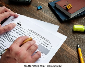 Business concept about Form 8848 Consent to Extend the Time to Assess the Branch Profits Tax Under Regulations Sections 1.884-2T(a) and (c) with sign on the piece of paper. - Shutterstock ID 1886626312