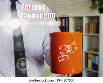 Business Concept About Fortune Global 500 Man With A Cup Of Coffee In The Background.
