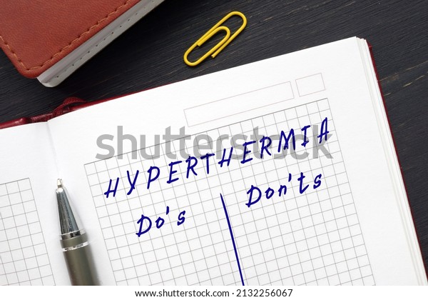Business concept about HYPERTHERMIA Do\'s and\
Don\'ts with sign on the\
sheet.\
