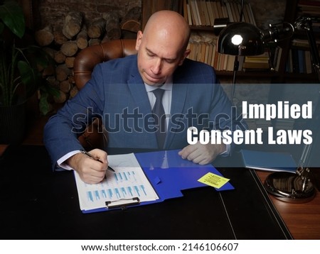 Business concept about Implied Consent Laws . Closeup portrait of unrecognizable successful businessman wearing formal suit reading documents
