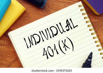 Business Concept About INDIVIDUAL 401(K) Question Marks With Sign On The Piece Of Paper. 
