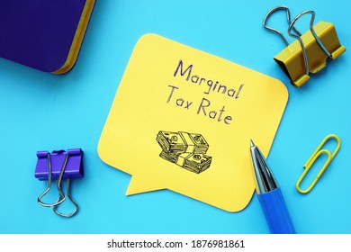 Business concept about Marginal Tax Rate with inscription on the sheet.