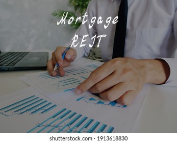 Business Concept About Mortgage REIT With Phrase On The Page.
