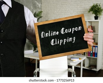 Business Concept About Online Coupon Clipping With Sign On The Piece Of Paper.