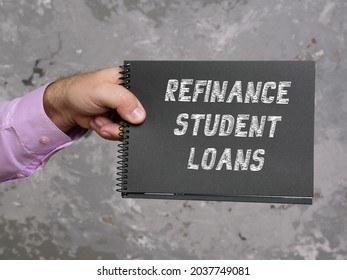 Business Concept About REFINANCE STUDENT LOANS With Phrase On The Sheet. 
