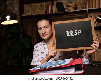 Business Concept About Registered Retirement Savings Plan RRSP With Sign On Black Chalkboard. 
