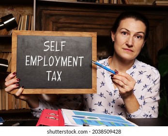 Business Concept About SELF EMPLOYMENT TAX With Inscription On The Black Board 
