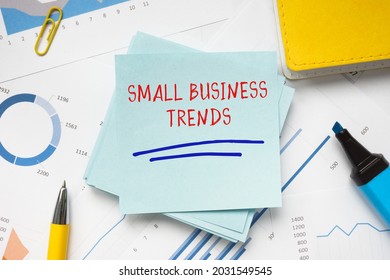 Business Concept About SMALL BUSINESS TRENDS With Phrase On The Piece Of Paper. 
