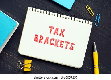 Business Concept About TAX BRACKETS With Sign On The Page. Tax BracketsÂ show You TheÂ taxÂ rate You Will Pay On Each Portion Of Your Income.
