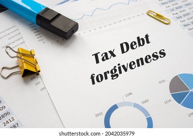 Business Concept About Tax Debt Forgiveness With Phrase On The Piece Of Paper. 
