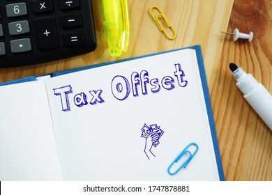 Business Concept About Tax Offset With Phrase On The Piece Of Paper.