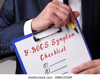 Business Concept About Y-BOCS Symptom Checklist With Inscription On The Page.
