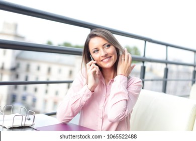 business concept - businesswoman talking on the phone
