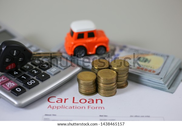 Business concept, car\
insurance, sell and buy car, car financing, car key for Vehicle\
Sales Agreement.