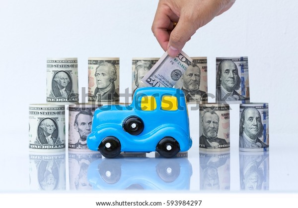 Business concept, car model bank in front of\
money background