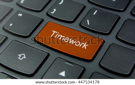 Business Concept: Close-up the Timework button on the keyboard and have Orange color button isolate black keyboard