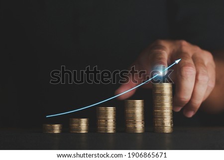 Business concept coin investment growth graph display