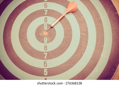 Business as concept. Dart is an opportunity and Dartboard is the target and goal. So both of that represent a challenge to targets.  Bullseye and Dart to be symbol of hit to target.