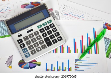Business concept with documents, calculator and pen