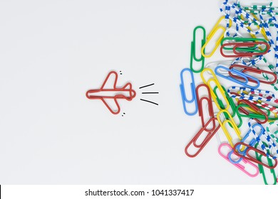 Business concept for group of stacked paperclip with another one red plane paperclip is point to another direction as a team leadership - Shutterstock ID 1041337417