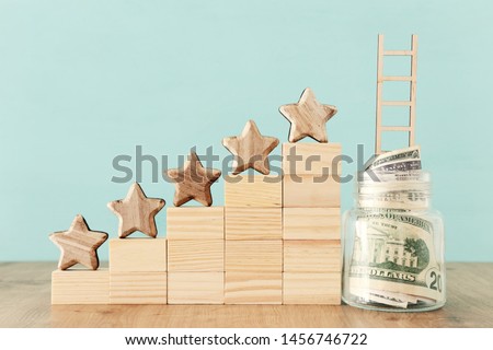business concept image of setting a five star goal. increase rating or ranking, evaluation, money investment and financial growth concept