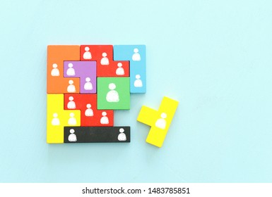 Business Concept Image Of Tangram Puzzle Blocks With People Icons Over Wooden Table ,human Resources And Management Concept