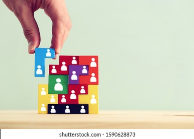 Business Concept Image Of Tangram Puzzle Blocks With People Icons Over Wooden Table, Human Resources And Management Concept