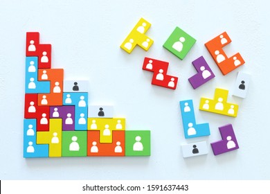 Business Concept Image Of Tangram Puzzle Blocks With People Icons Over Wooden Table, Human Resources And Management Concept