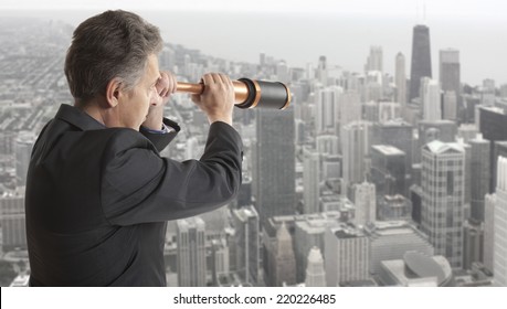 Business Concept.  Business Man Looks Through A Telescope