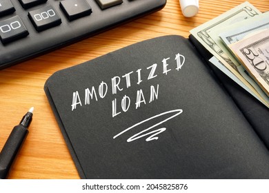 Business concept meaning AMORTIZED LOAN with sign on the sheet. 
