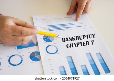 Business concept meaning BANKRUPTCY CHAPTER 7 with sign on the chart sheet. 