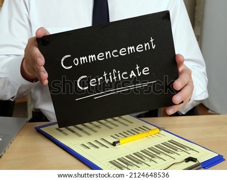 Business concept meaning Commencement Certificate with inscription on the sheet.
