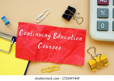 Business Concept Meaning Continuing Education Courses With Inscription On The Piece Of Paper.