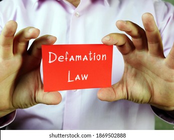 Business Concept Meaning Defamation Law With Phrase On The Piece Of Paper.
